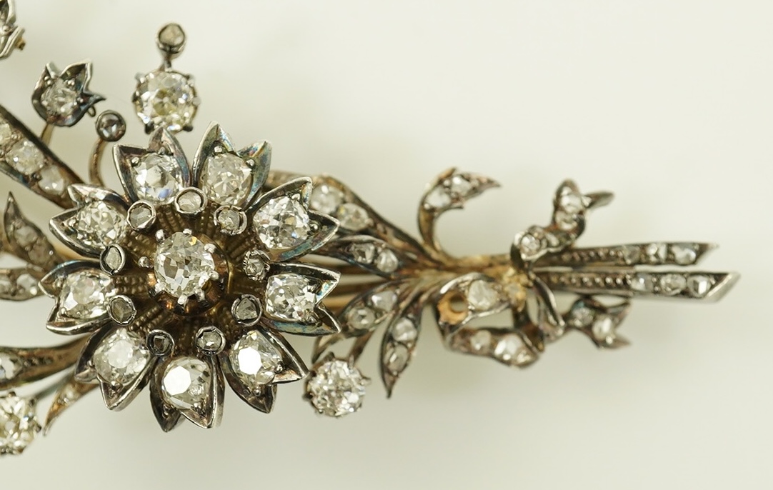 A Victorian gold, silver and diamond cluster foliate spray brooch